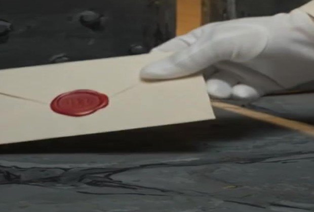 A cream envelope closed with a red wax seal